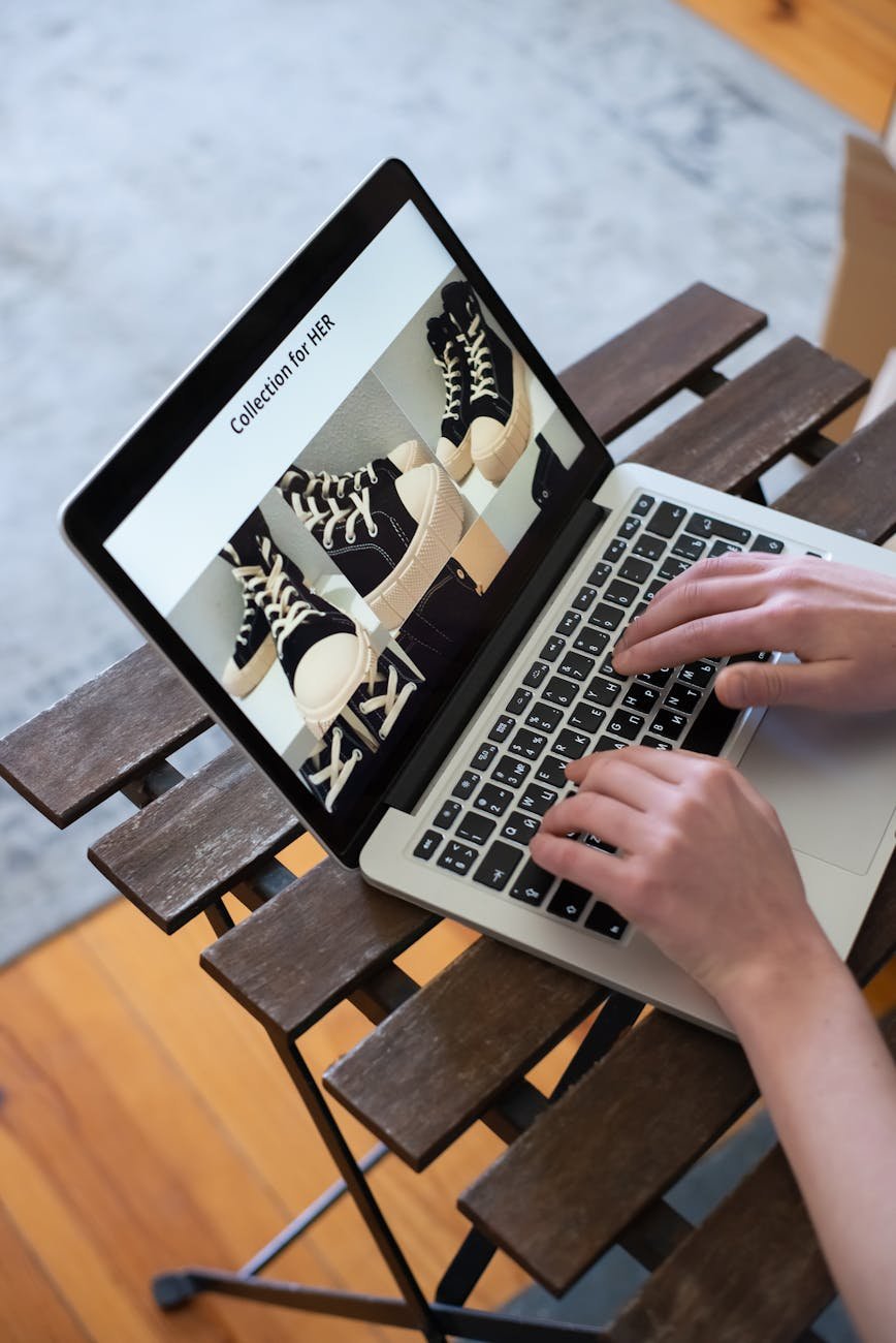 person using gray laptop